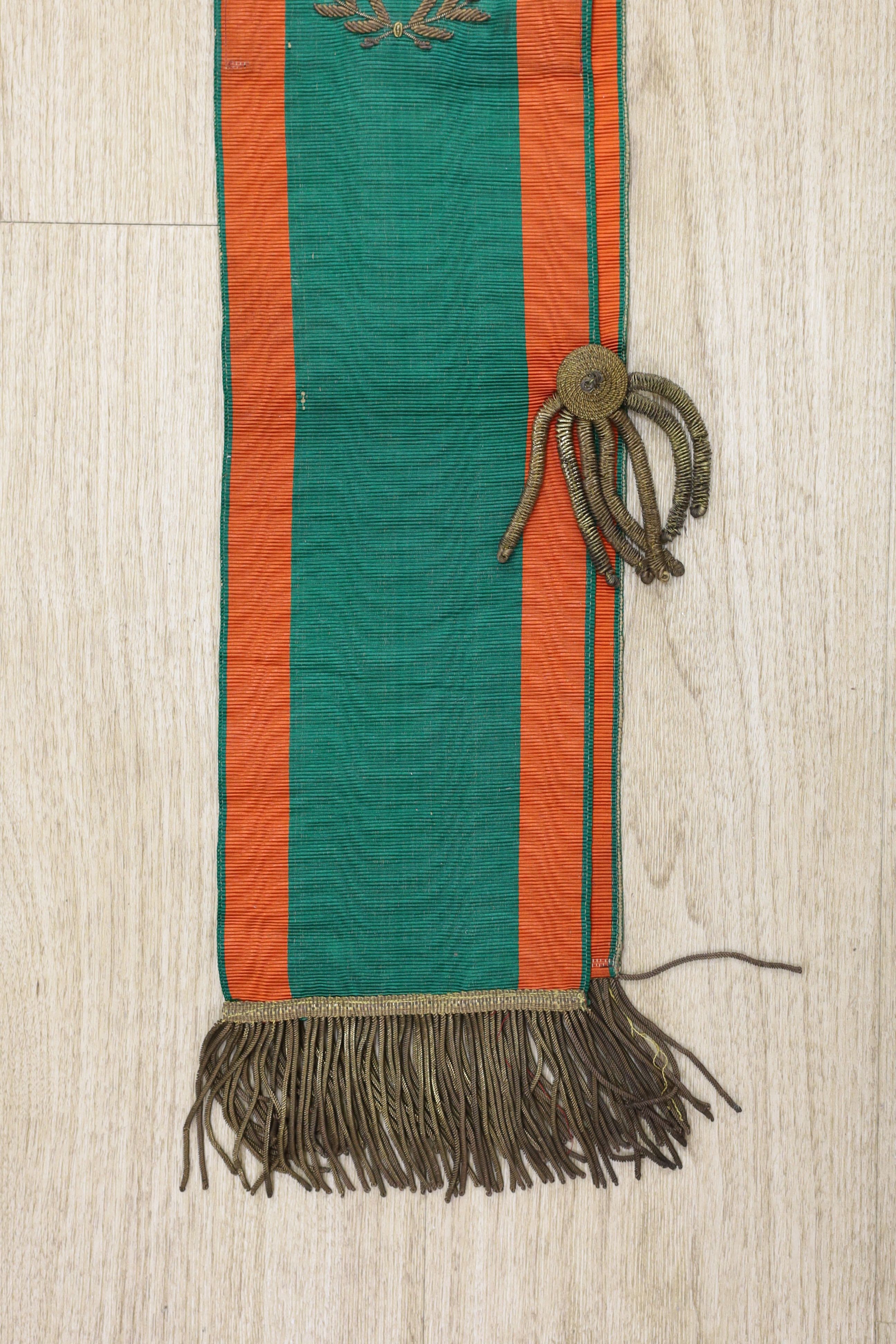 Railway Interest - A metal thread embroidered silk sash inscribed ‘Railway Men of E I S & W, Broad Street Branch - presented to E.J. Foulkes by branch benevolent fund’ - approx 190cm long